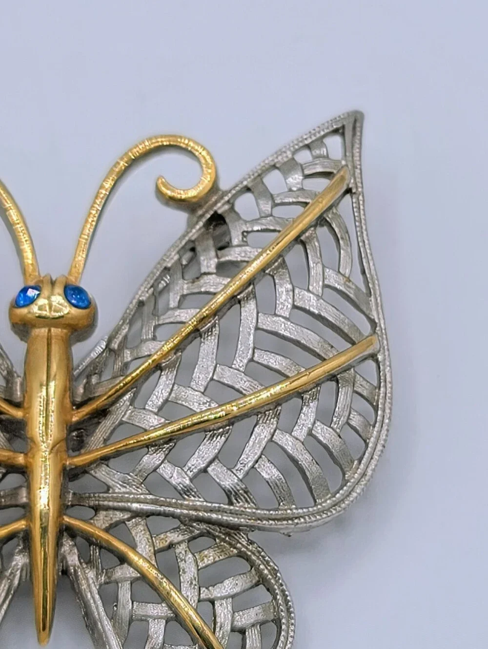 Avon Butterfly Brooch Two Tone Gold Silver Openwork Blue Rhinestone Eyes Vintage